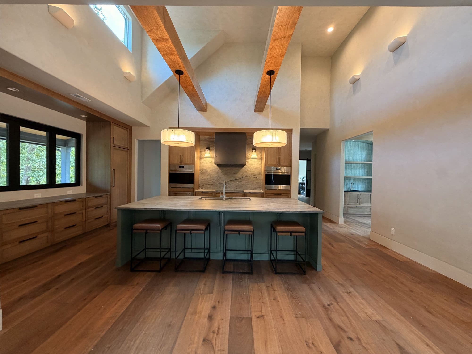 Kitchen island with seating under exposed beams